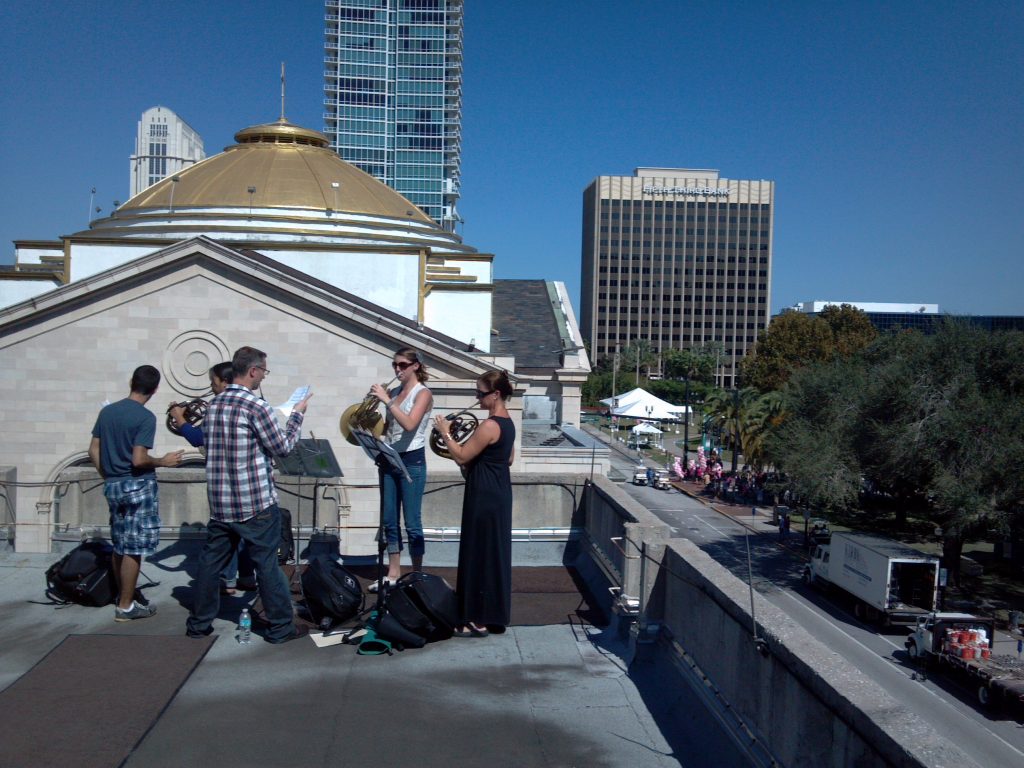 Performing on a balcony, one of our locations around the city.