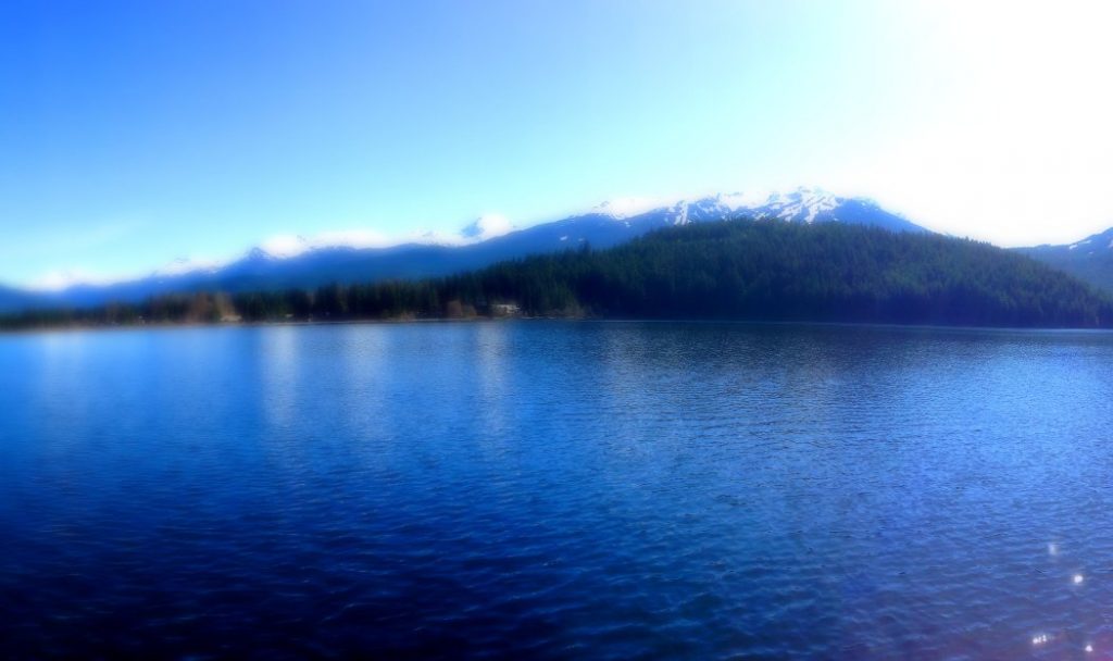 Another view of the Rainbow Park mountain range where the snow caps reflect in the lake below.