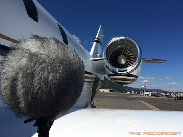A mic with a thick wind muff faces the propeller of a private jet. Article edited by Adriane Kuzminski.
